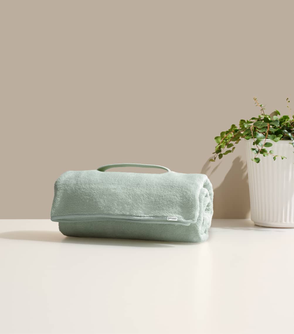 Hair towel with a plant on its side