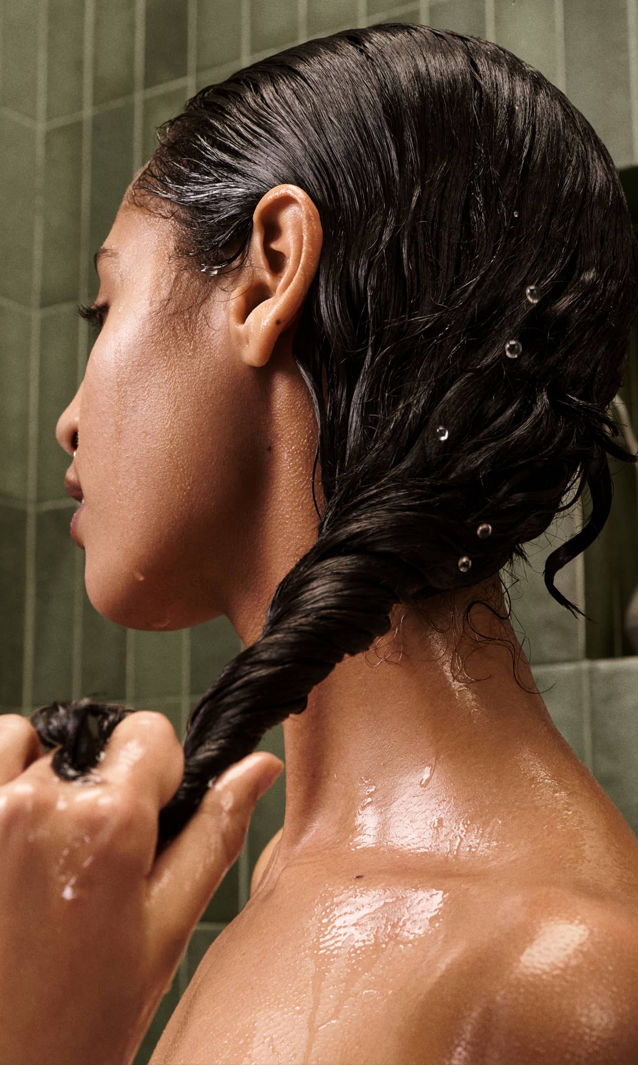 Prose Custom Hair Mask jar surrounded by water droplets against a green background.