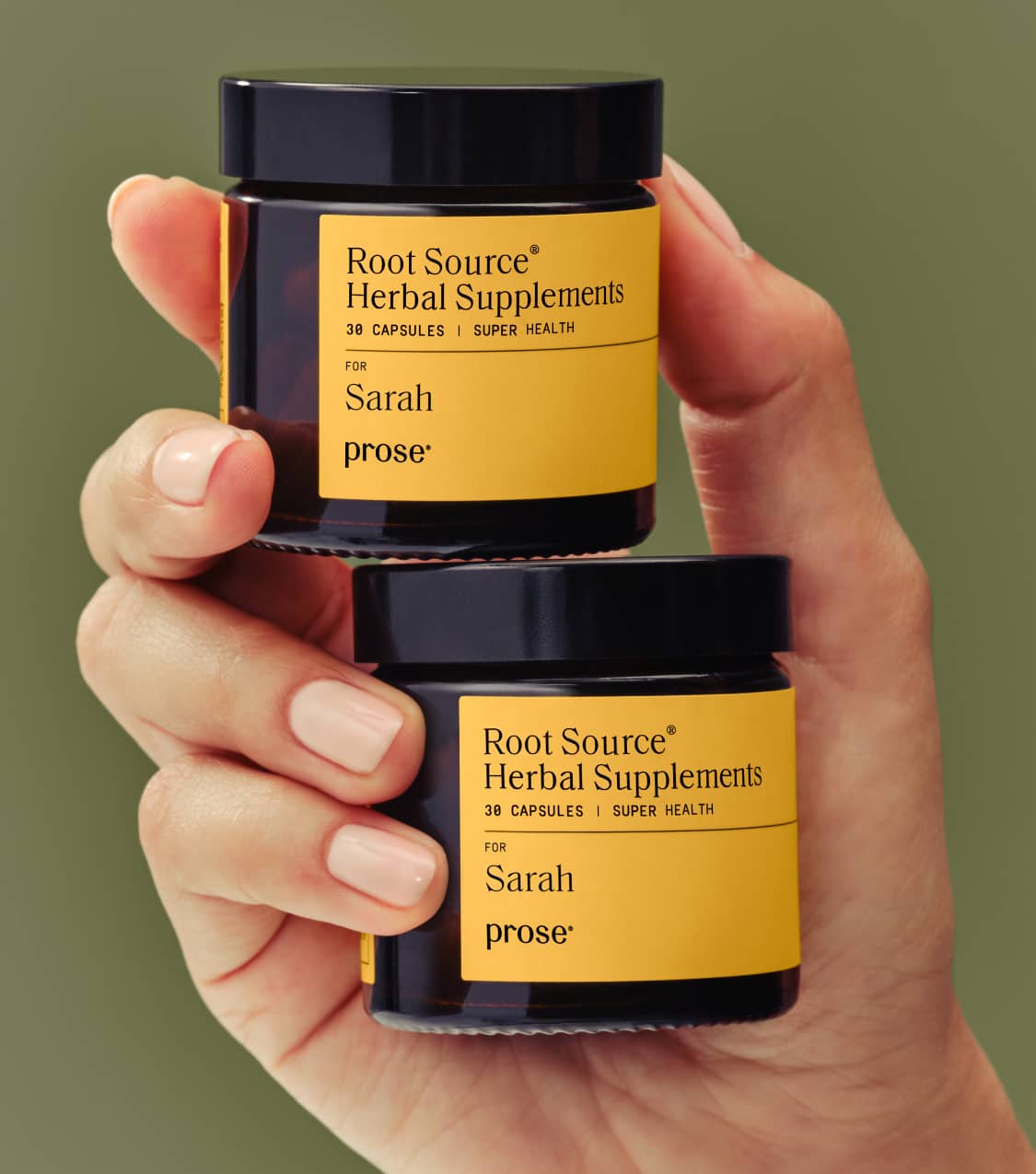 Prose model holding custom root source hair supplements in packaging